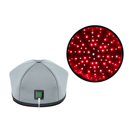 The Glow Cap red light therapy cap in Gray with control button
